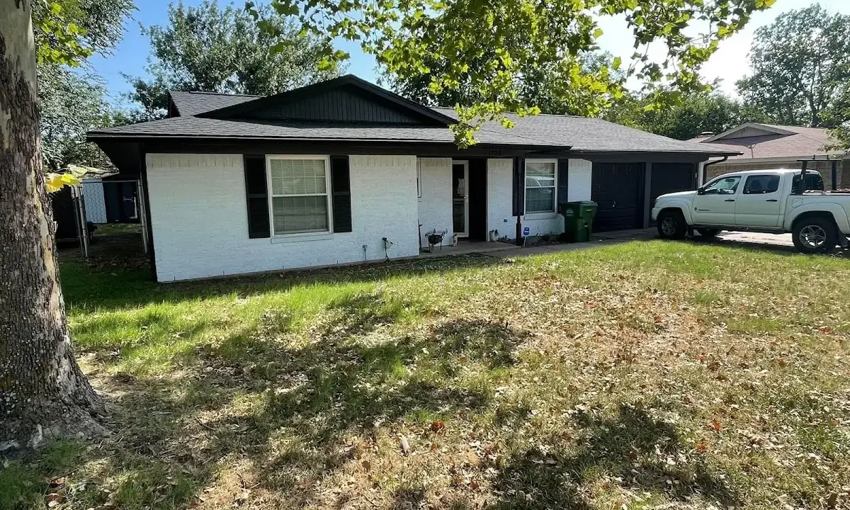 Professional roofing crew working on a residential roof in Kannapolis
